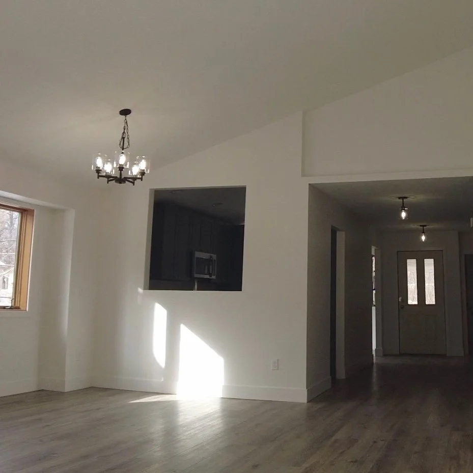 The same interior finished with smooth painted drywall walls and ceiling